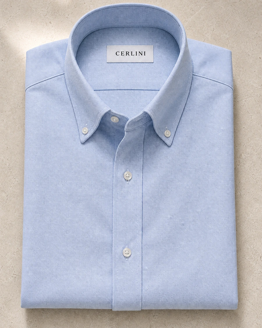 The Weekender in light blue Oxford, a Cerlini shirt arranged with its collar and cuff visible.